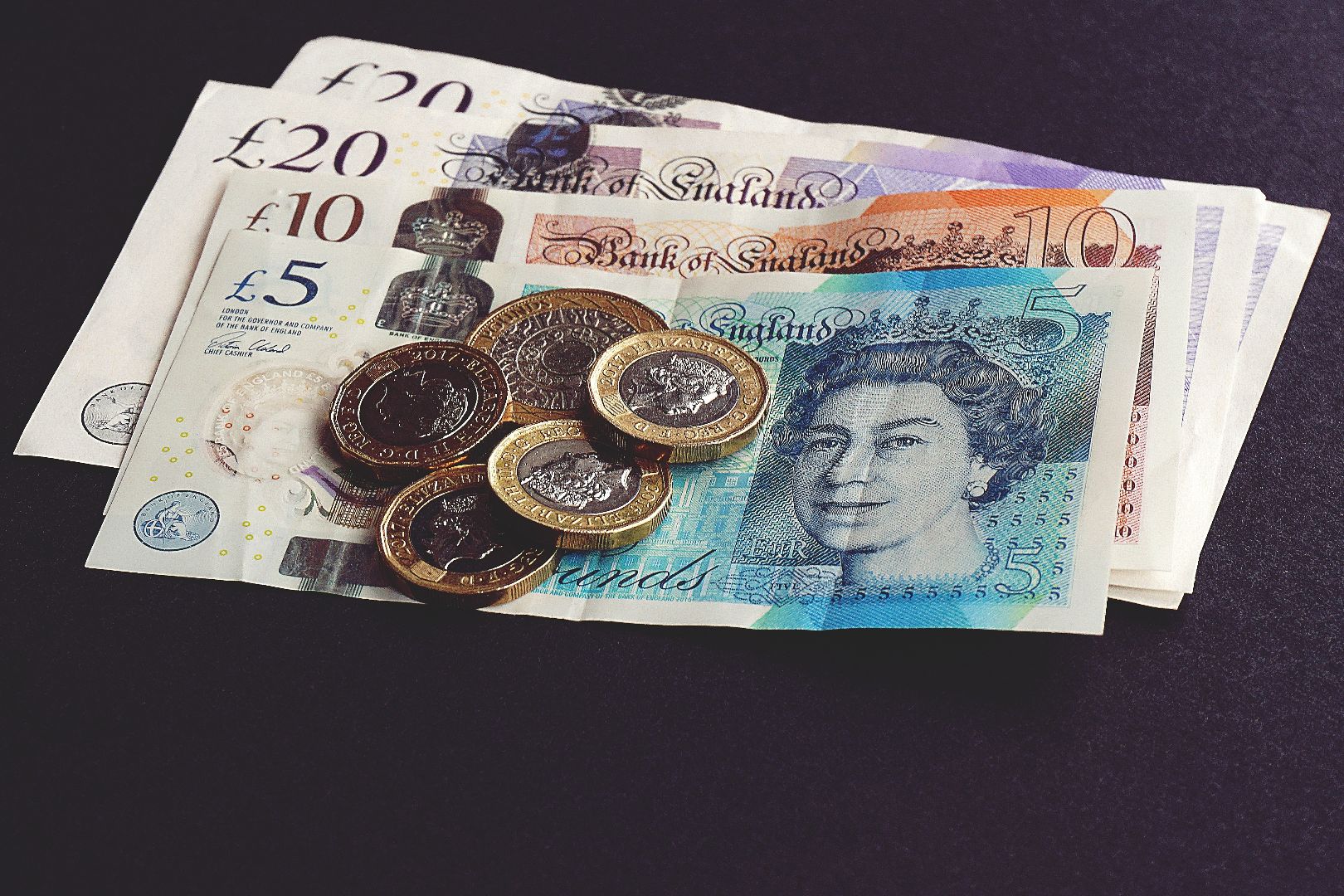 Photograph of UK bank notes and pound coins