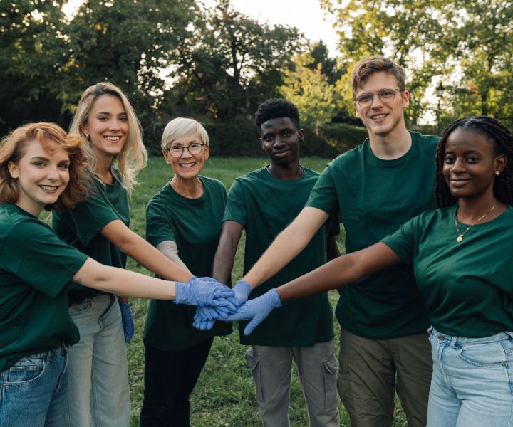 group-of-volunteers-putting-hands-together-wearing-2025-04-03-19-45-44-utc.jpg