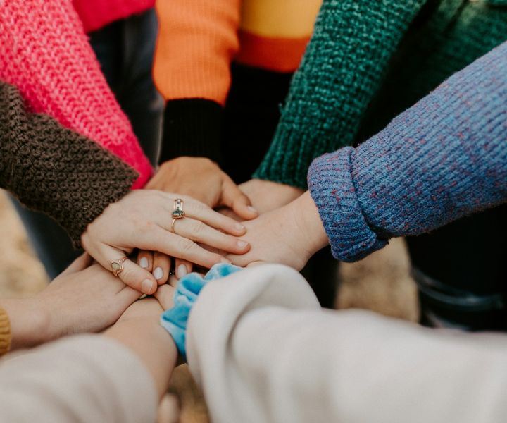 Hands in a pile of unity