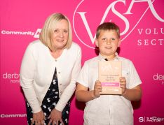 Zach Bowles, winner of the Young Volunteer Award – Age 5-14, receiving his award from Ann Rowlands, the outgoing Chief Executive of Umbrella Derby and Derbyshire who is retiring this year.