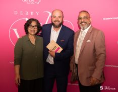 Kenny Sharpe, winner of the Sporting Award, with award presenter Vijay Kumari from The National Lottery Community Fund and award host Amo Raju OBE DL