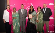 Surtal Arts, winner of the Arts, Culture and Heritage Award, receiving their award from Paul Simpson, Chief Executive of Derby City Council.