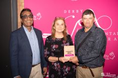 Volunteers from Community Café & Storehouse Meal, winner of the Community Space Award, receiving their award from Asaf Afzal, one of Community Action’s trustees.