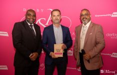 Mark Richardson, winner of the Trustee of the Year Award, with award presenter Ray Khumalo, Chair of the Board of Trustees at Community Action Derby and award host Amo Raju OBE DL