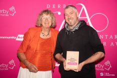 Simon Jones from Thrivemind Village, winner of the Green Ambassador Award, with Pauline Inwood from Derby Climate Coalition.